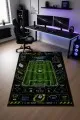 Çok renkli oyun halısı üzerinde futbol sahası, top, kale, skor paneli ve oyun kolu simgeleri yer alır