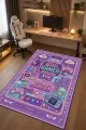 Çok renkli oyuncu halısında girl gamer yazısı, oyun kumandası, kulaklık, klavye ve kalp motifleri görülür